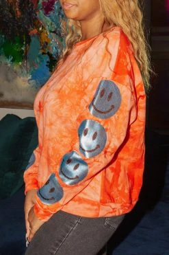 Shop Queen Of Sparkles Sweatshirts Smiley Sequin Sleeve Sweatshirt Red Tie Dye