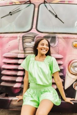 Shop Queen Of Sparkles Neon Green Holo Stripe Flutter Top Spring 2022